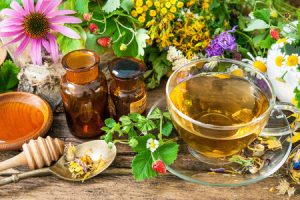 43283067 - cup of herbal tea with wild flowers and various herbs
